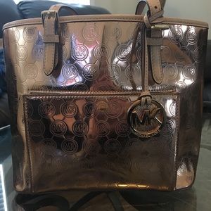 Michael Kors metallic rose gold handbag
